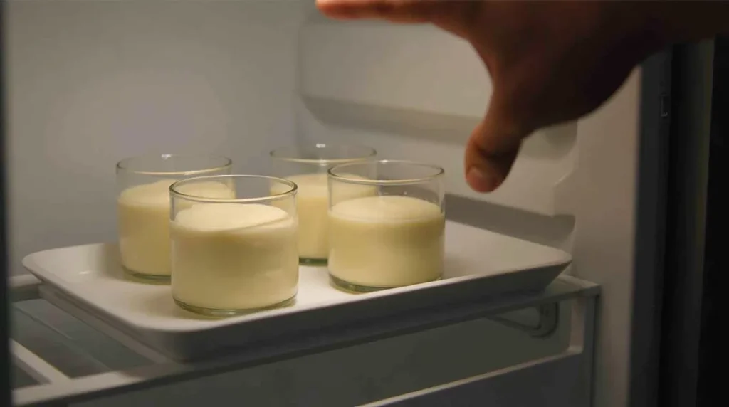 Glass cups of Baileys mousse set in fridge to chill